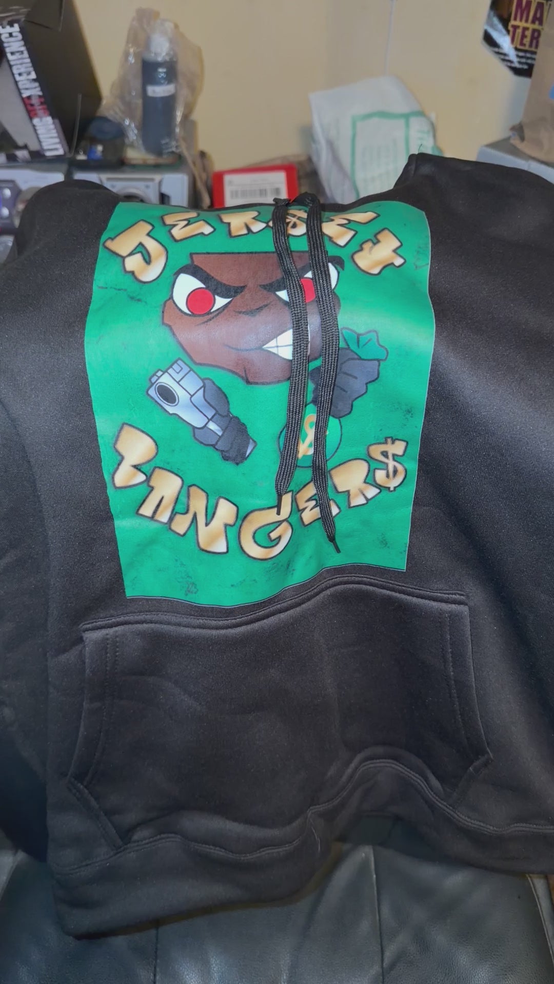 Black hoodie green background